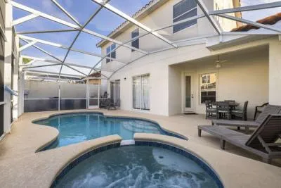 Pool and spa showing dining  table and loungers