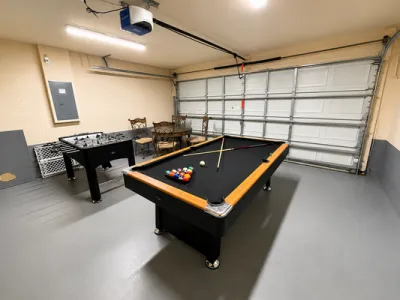Game room showing pool table and foosball.