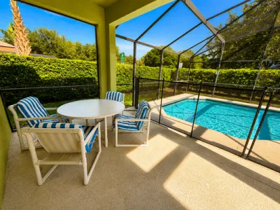 Pool area showing dining table seating for 4.