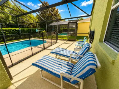Pool area showing sun loungers.