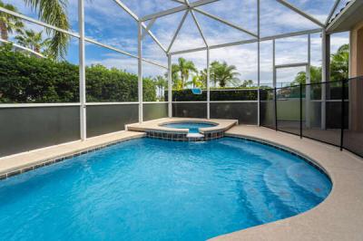 Pool and spa showing screen enclosure