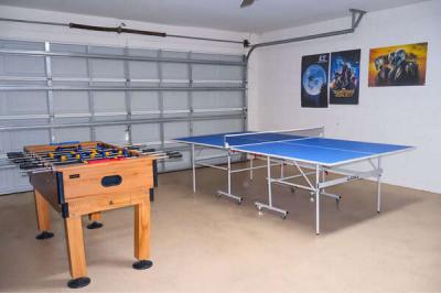 Games room showing foosball and ping pong table