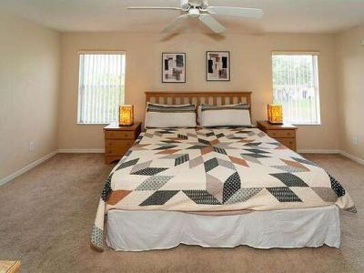 Master bedroom showing king bed from front angle.