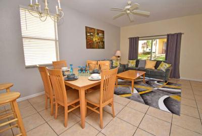 Family living area with patio doors to small seating area