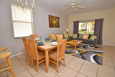 Family living area with patio doors to small seating area