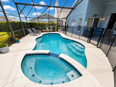 Pool area showing sun loungers