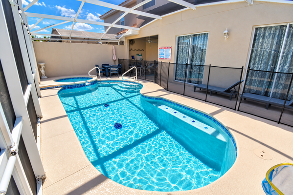 Pool area showing sun loungers and pool safety screen