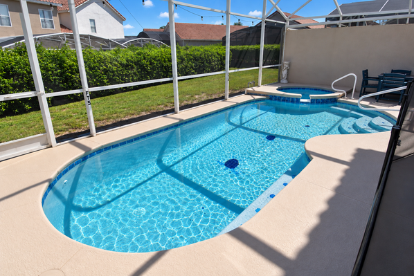 Screened in private pool with spa