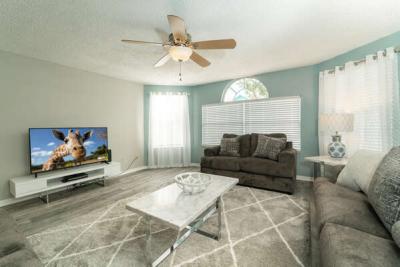 Spacious living room with flat panel TV and DVD
