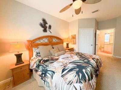 Master bedroom showing king bed and en-suite entrance.