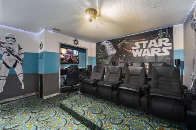 Upstairs star wars themed movie theater with games console