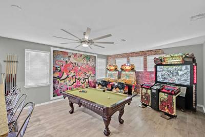 Games room is in the upstairs loft area. custom designed for vacation pleasure.