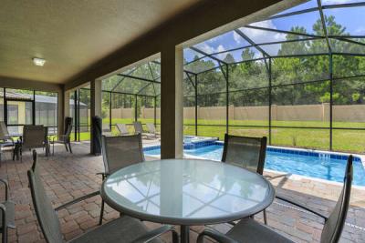 Enjoy meals underneath the covered lanai and experience the beautiful Florida weather