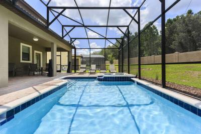 The whole family will love the private screened-in pool and spillover spa