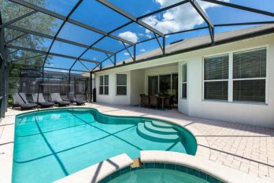 A screened-in private pool and spillover spa for all to enjoy