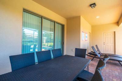 Covered Lanai showing outdoor dining seating for 8