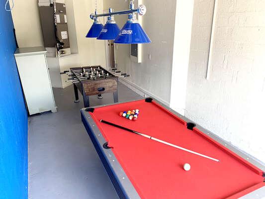 Games room showing pool table, and foosball table.