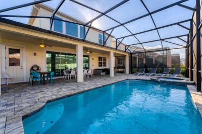 Pool view with safety fence put away showing pool seating area