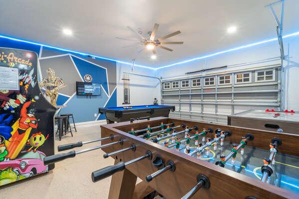 Star Wars themed games room showing foosball, pool table, air hockey, and arcade game