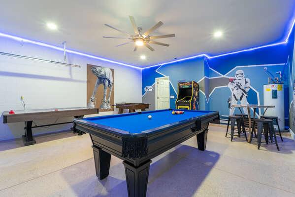 Star Wars themed game room with pool table, arcade machine, shuffleboard, and LED lighting.