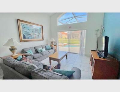 Family seating area showing patio doors and flatscreen TV
