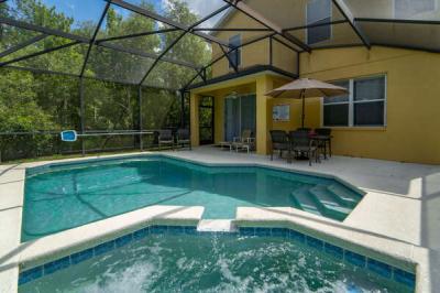 Pool area showing dining area and lanai Game room shwoing pool table, air hockey tab;le