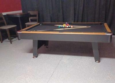 AC garage with pool table and seating