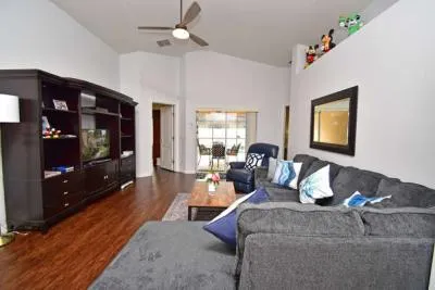 Comfortable lounge area with patio doors to pool area