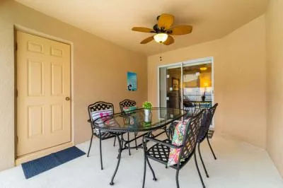 Shaded lanai area with patio dining table