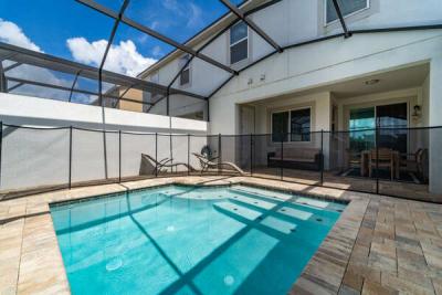 Splash pool with safety fence in place