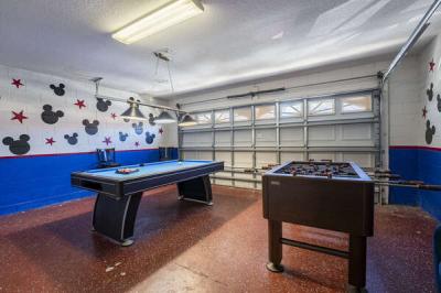 Game room showing pool table and foosball.