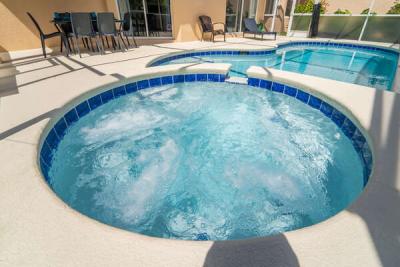 view of newly refinished bubbling spa (note: heated spa/pool available at extra charge and must be prearranged with host)