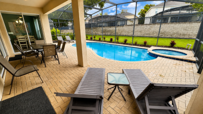Pool area showing sun loungers.