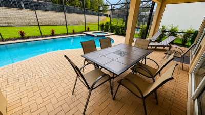 Pool area showing dining table seating for 6.