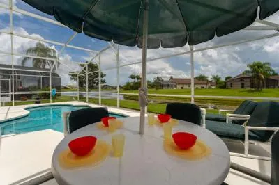 Umbrella provides a shady place for eating or keeping an eye on those in the pool