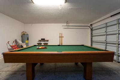 pool table located in garage area. Baby