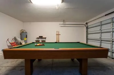 pool table located in garage area. Baby