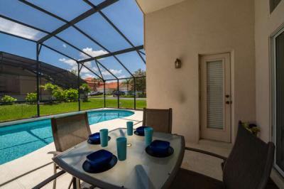 Covered lanai at the pool deck showing pool bath access