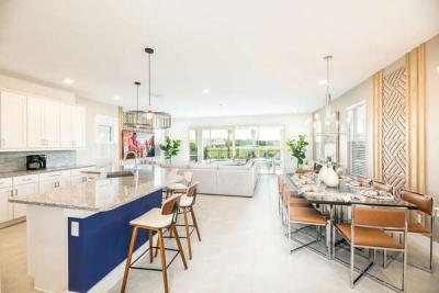 Step inside to the large open concept living area with modern, coastal-style furnishings