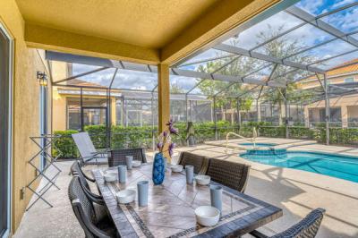 Pool area showing dining table with seating for 6