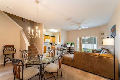 open floor plan showing living, dining and kitchen rooms