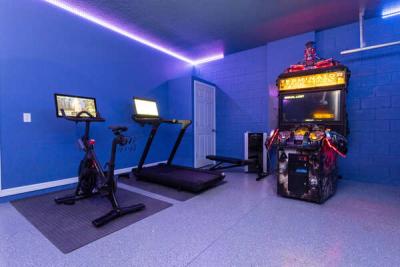 Stay in shape and let the fun continue with Peloton bikes in the garage with fun arcade games.