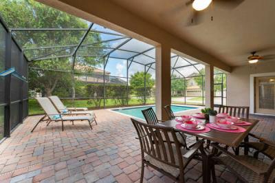 Covered lanai with ceiling fans and seating