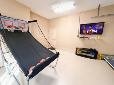 Basketball game inside game room.