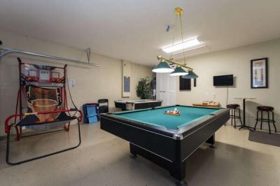 Game Room showing pool table air hockey and basketball hoop