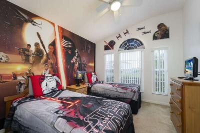 Bedroom showing TV and beds