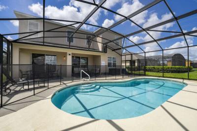 Screen enclosure surrounding pool showing covered lanai