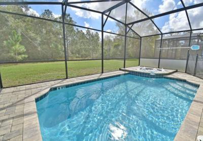 View of pool and spa showing privacy screen