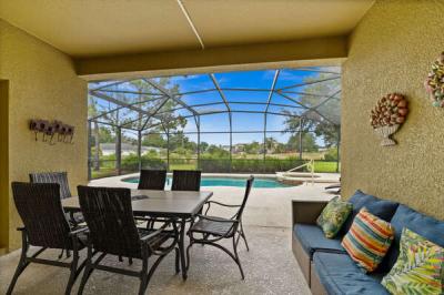 Covered lanai overlooking the pool. Its the perfect spot to enjoy a morning coffee or dining under the stars after a long day at the parks.