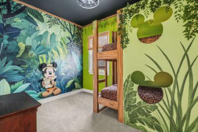 Kids will love this safari-themed bedroom featuring some of their favorite classic characters